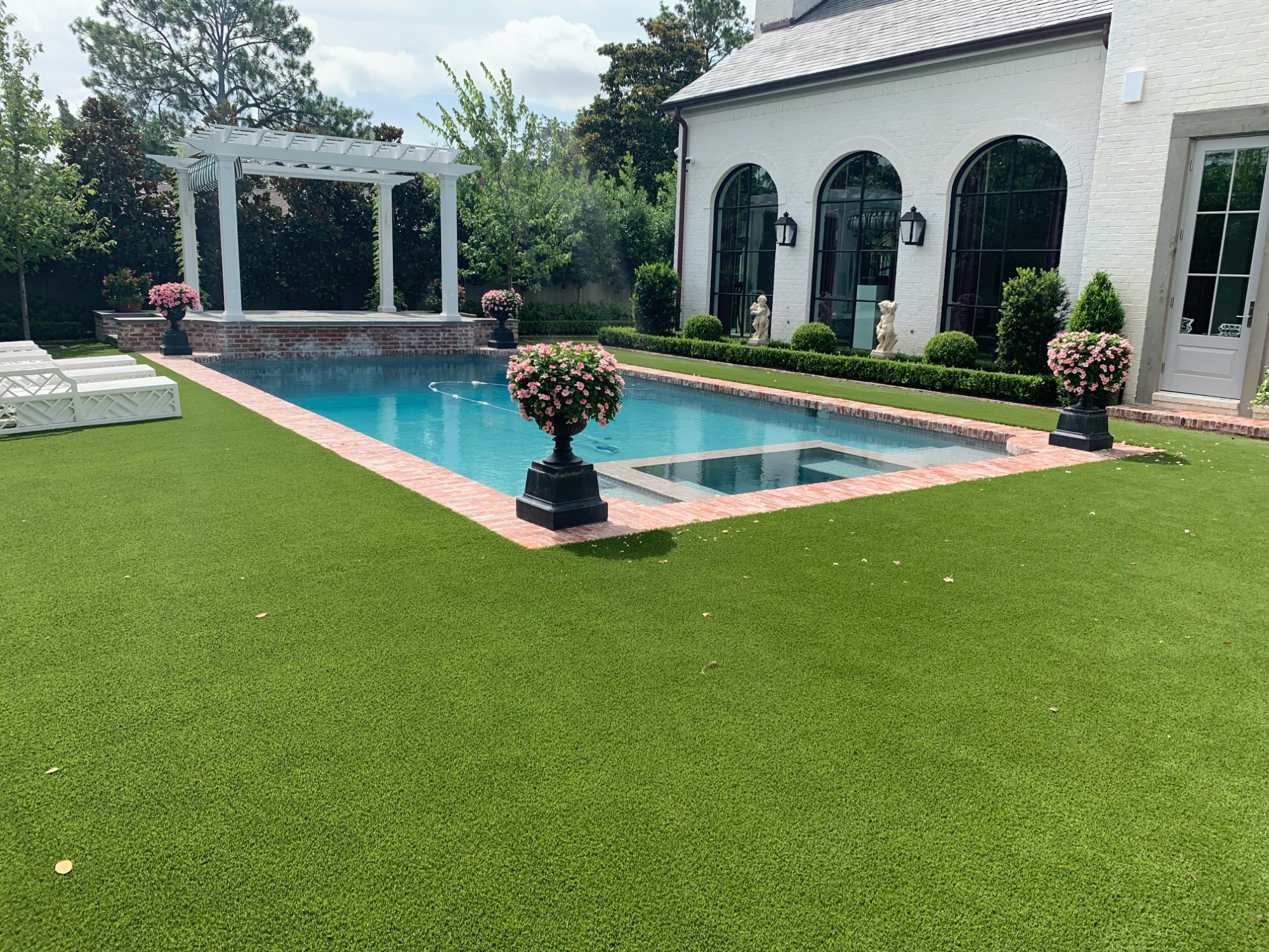 Luxury pool area with artificial grass in Canberra